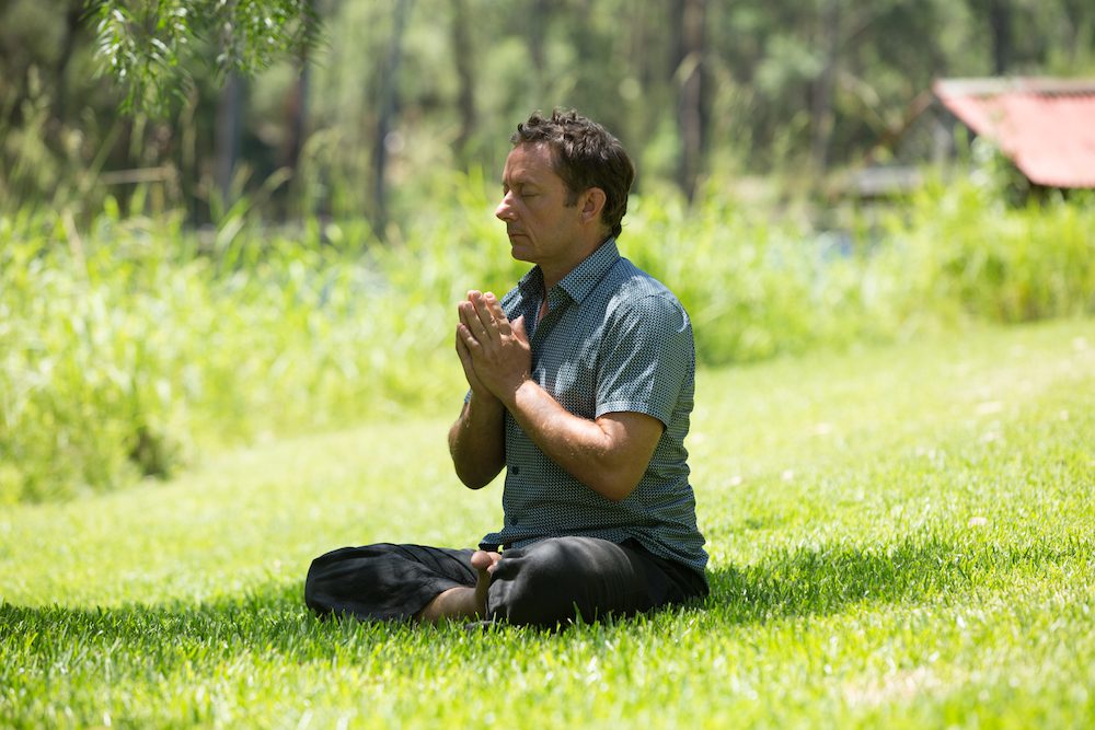 image of man meditating at one of our meditation retreats